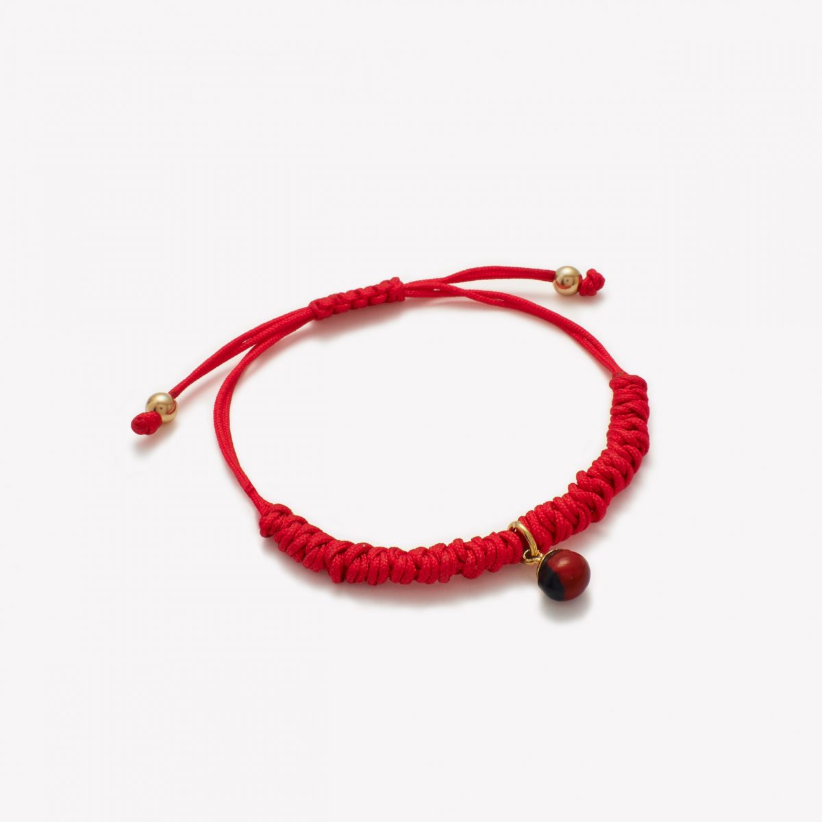 Pulsera macrame con huayruro