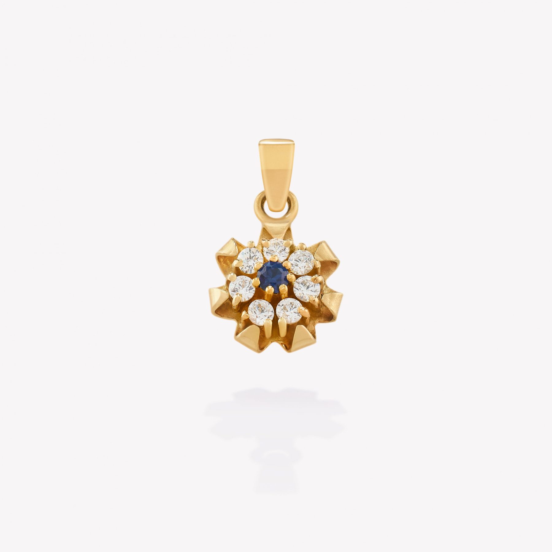 Dije oro 18k amarillo, Flor con Zafiro Azul y Circonios.