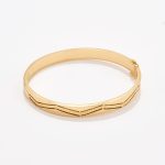 Semanario en oro 18k. amarillo con diseño Zig Zag.