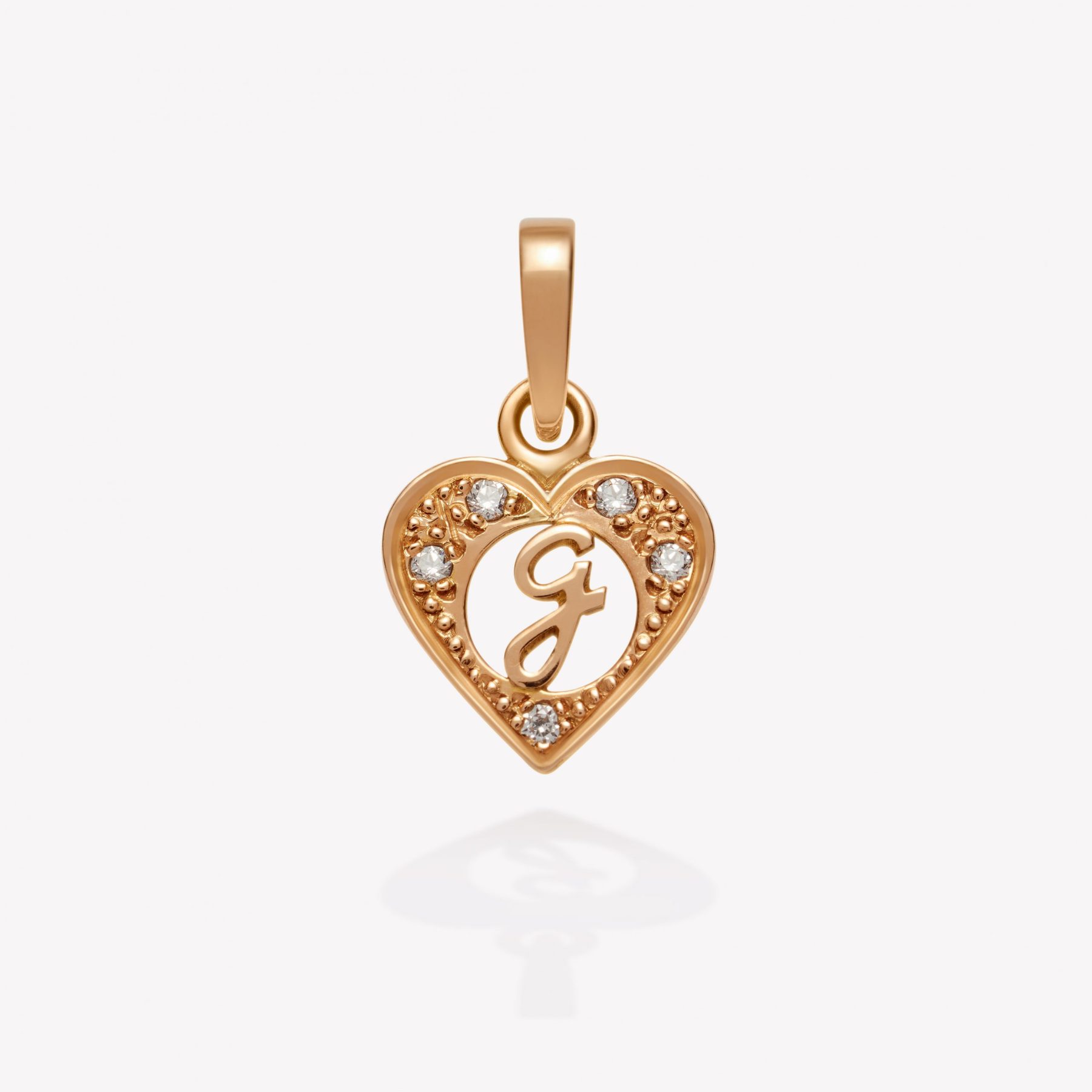 Dije oro 18k naranja, Corazón con inicial G inglesa.