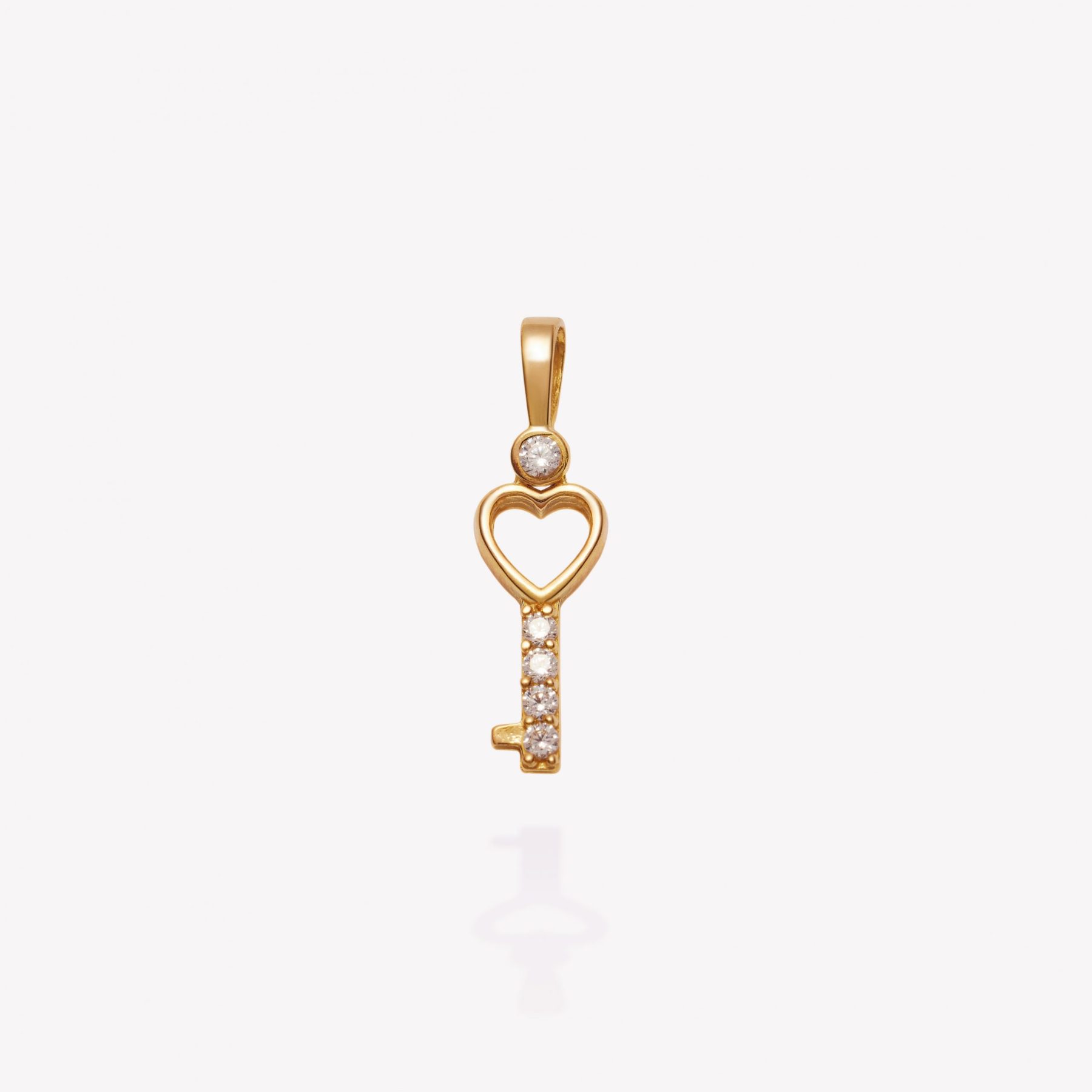 Dije oro 18k amarillo, Llave Corazón.