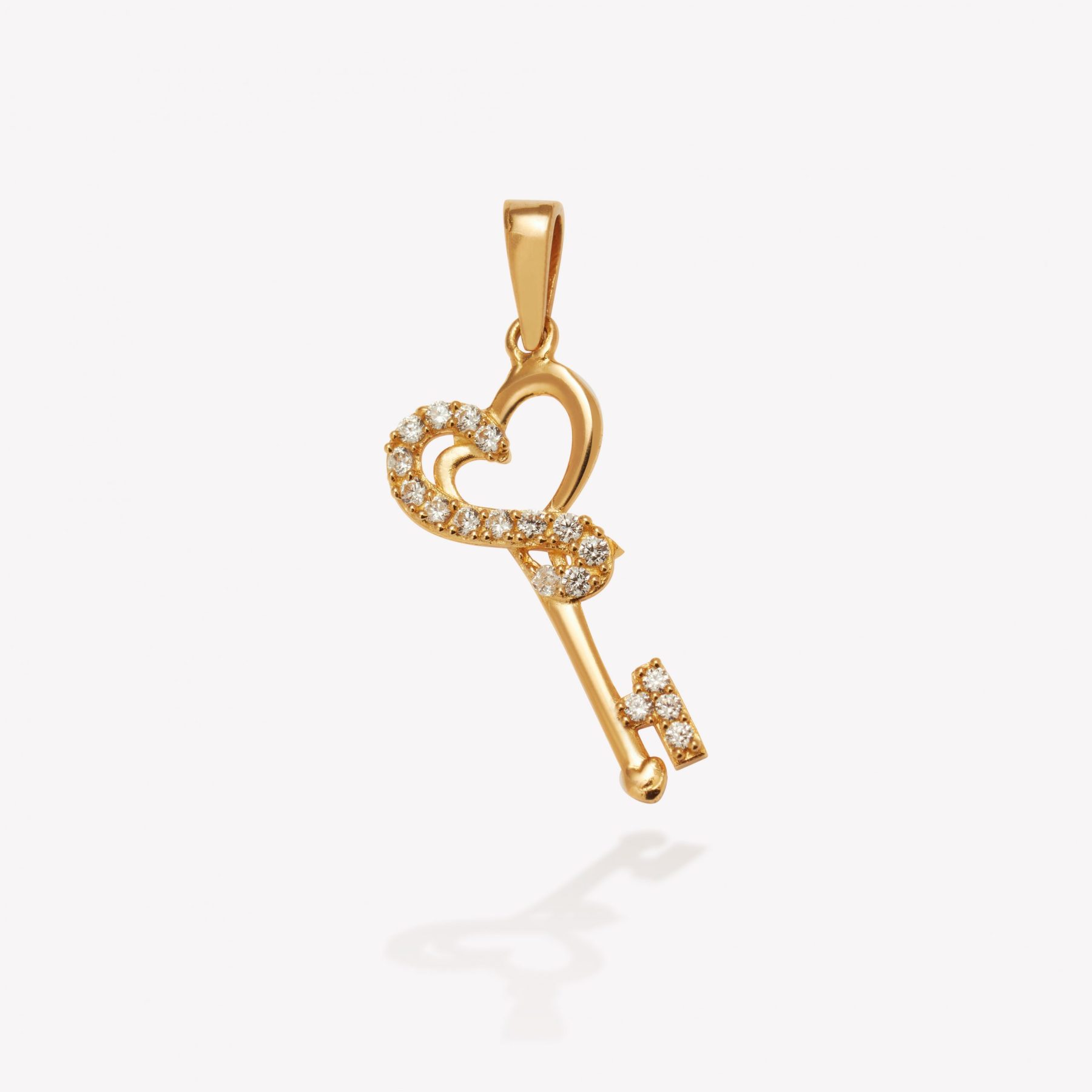 Dije oro 18k amarillo, Llave Corazón Musical.