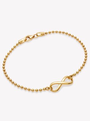 Pulsera bolitas con infinito en oro 18k. amarillo.