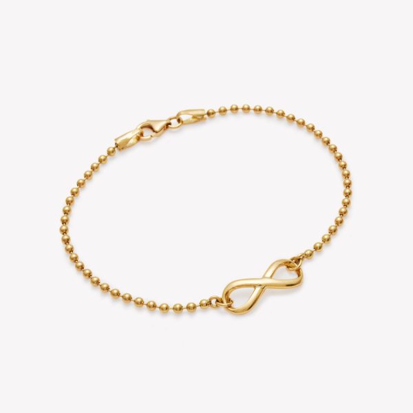 Pulsera bolitas con infinito en oro 18k. amarillo.