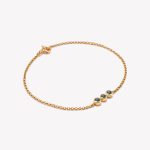 Pulsera en oro 18k. amarillo, Rollo con Topacio Azul.