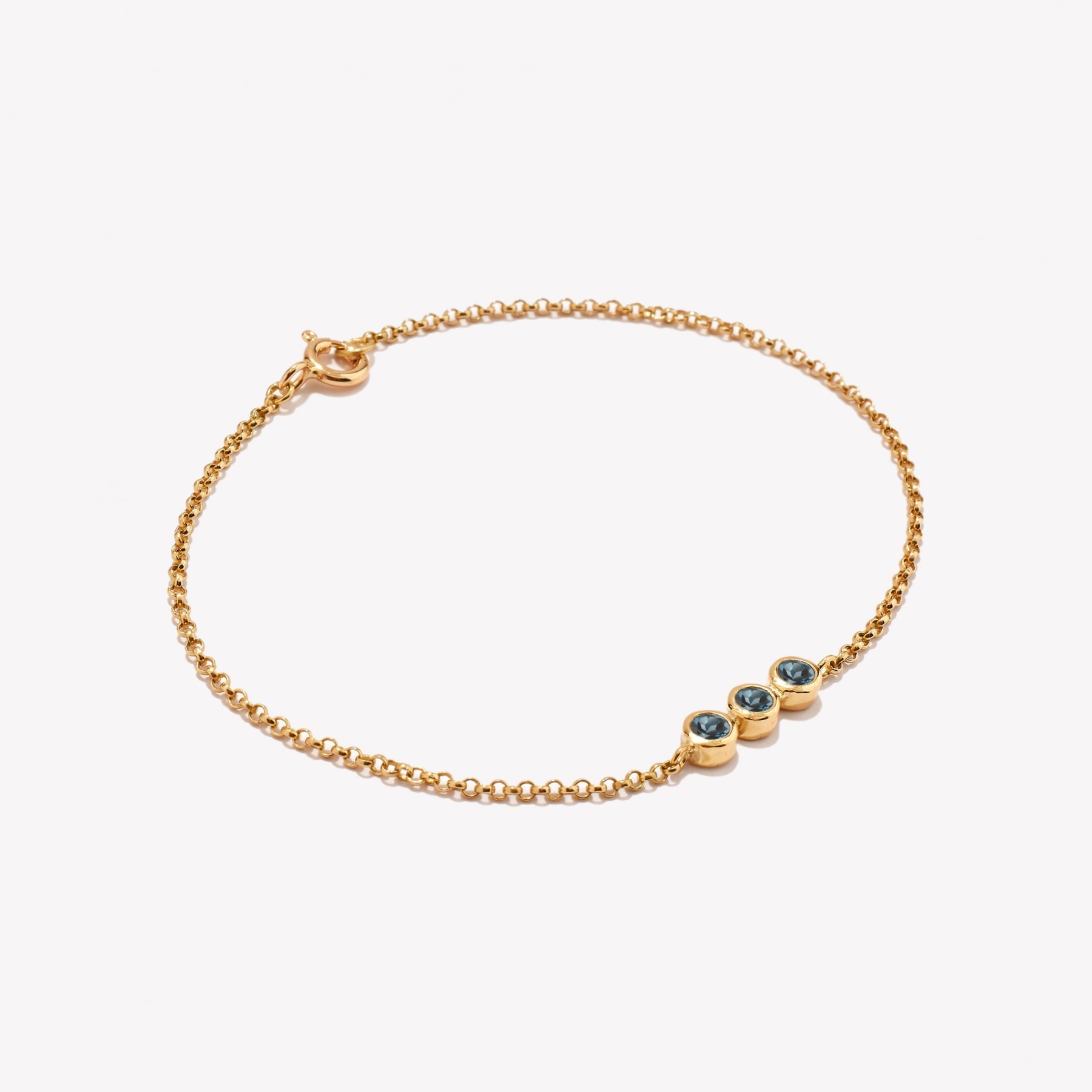 Pulsera en oro 18k. amarillo, Rollo con Topacio Azul.