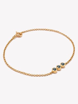 Pulsera en oro 18k. amarillo, Rollo con Topacio Azul.