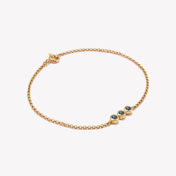 Pulsera en oro 18k. amarillo, Rollo con Topacio Azul.