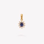 Dije oro 18k amarillo, roseta con Zafiro Azul.