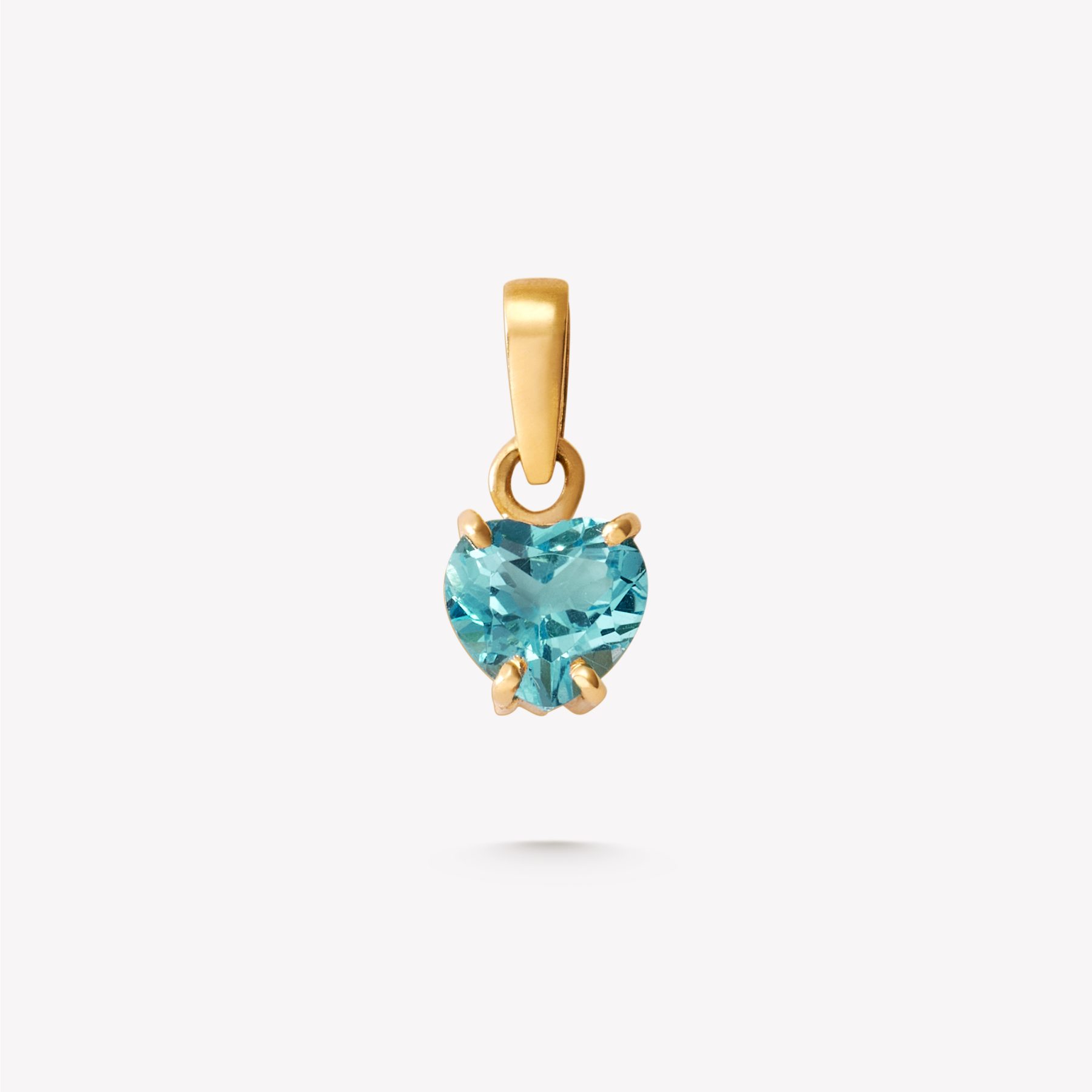 Dije oro 18k amarillo, TOPACIO AZUL corazón