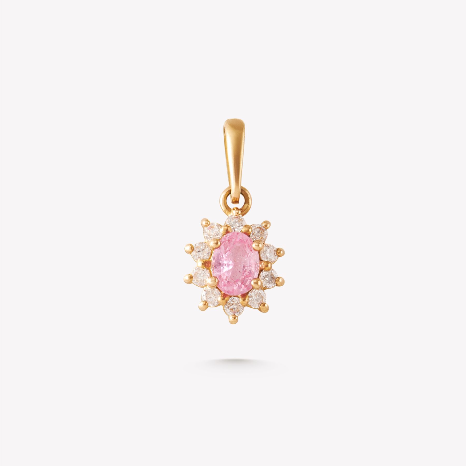 Dije oro 18k amarillo, mini roseta con zafiro rosa