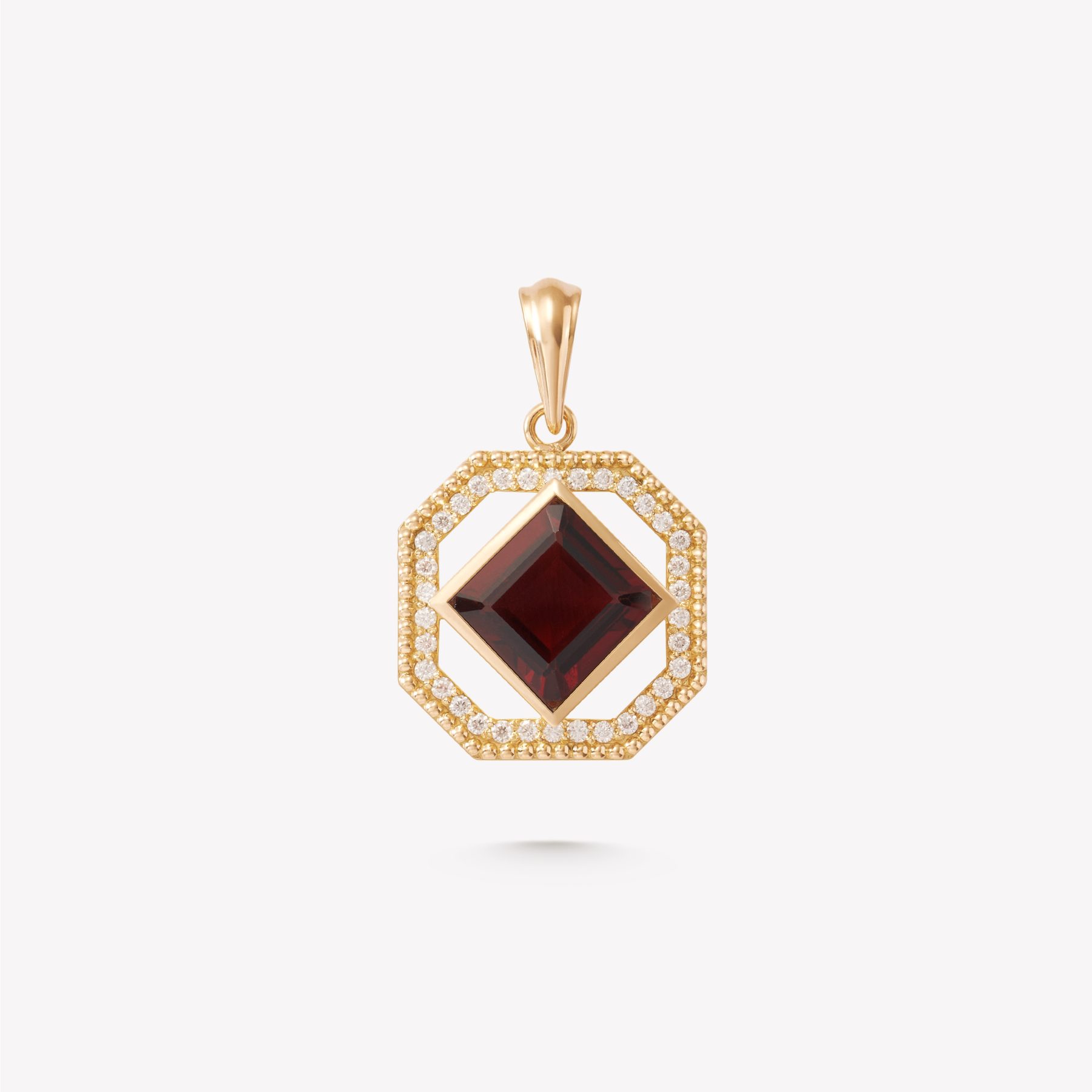 Dije oro 18k amarillo, con PIEDRA GRANATE