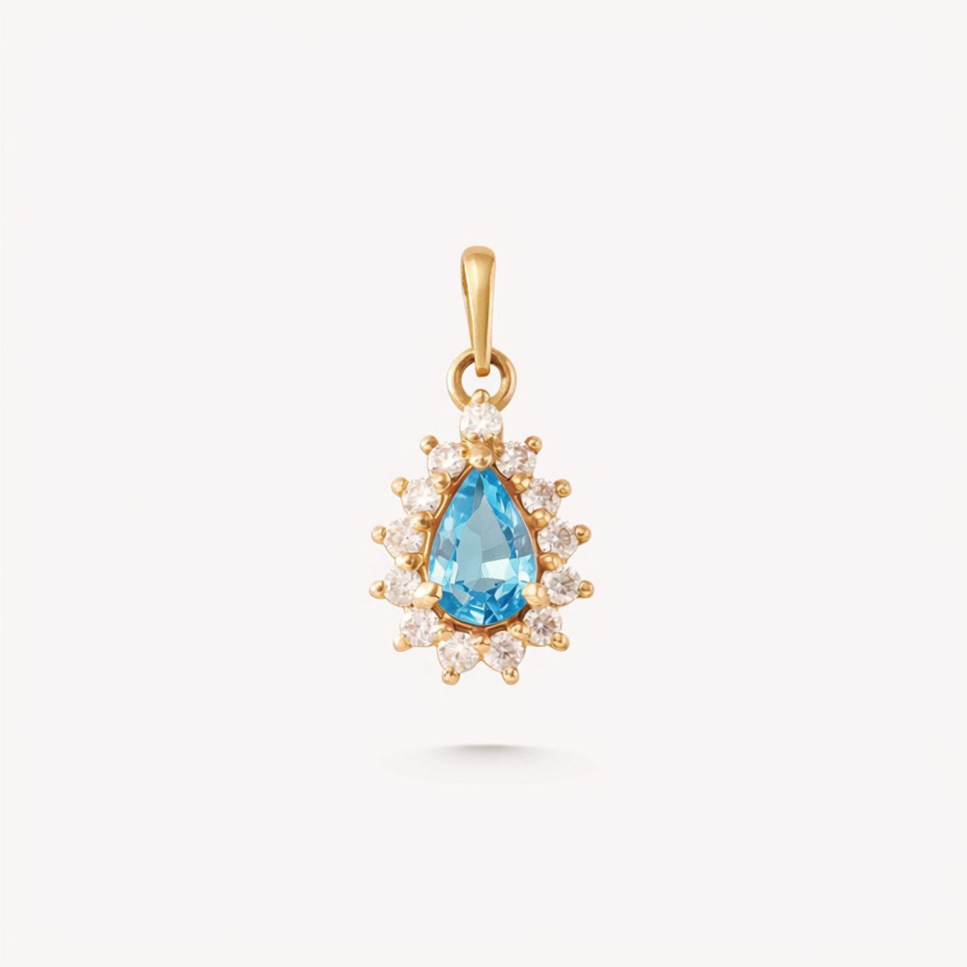 Dije ROSETA TOPACIO AZUL GOTA y moissanitas en oro amarillo 18k